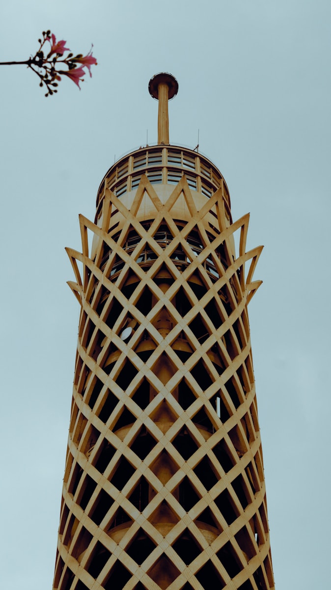 a very tall tower with a clock on it's side