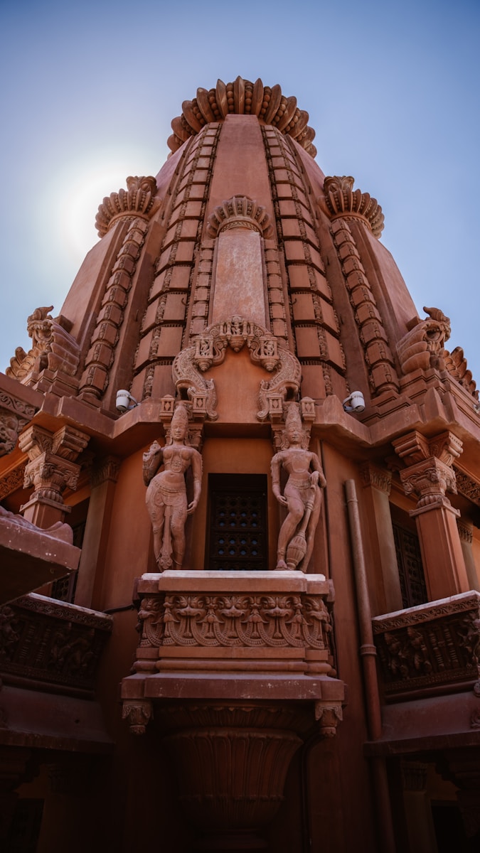 a building with statues on the outside